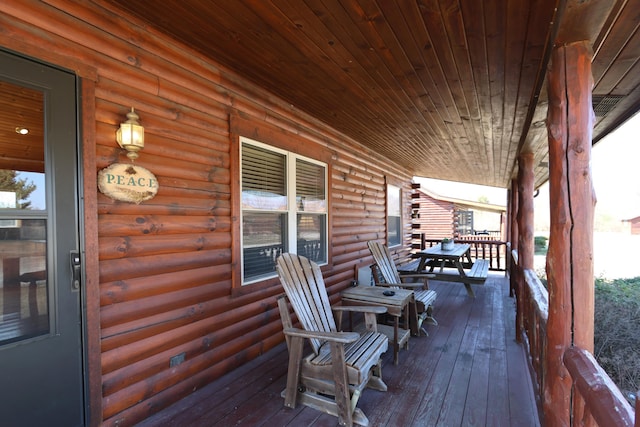 wooden terrace featuring a porch