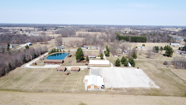 birds eye view of property with a rural view