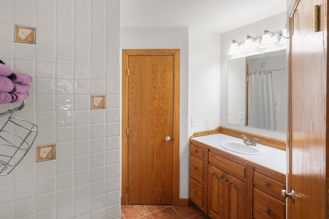 full bath featuring tile patterned flooring and vanity