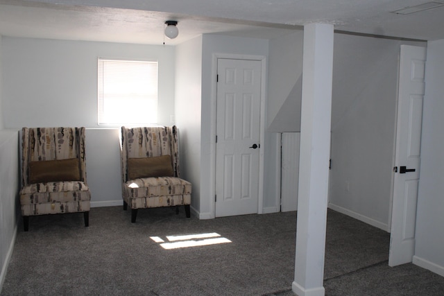 sitting room featuring carpet flooring, visible vents, and baseboards