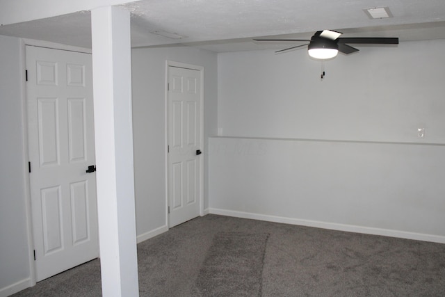 empty room with baseboards, a ceiling fan, and carpet floors