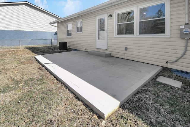 view of patio / terrace featuring central AC unit and fence