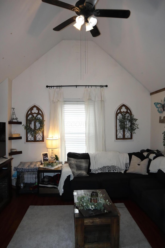 living area with high vaulted ceiling, a ceiling fan, and wood finished floors