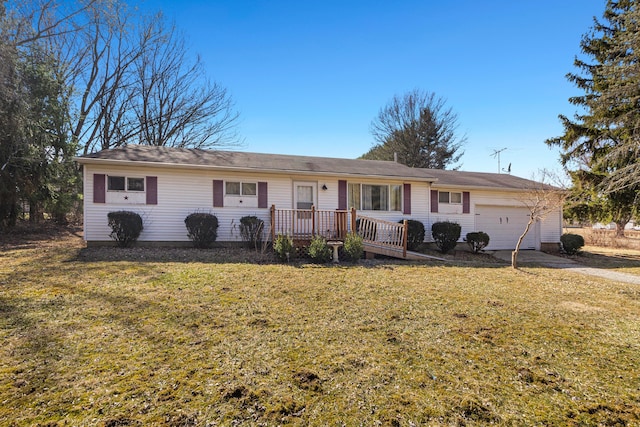 single story home with a front yard and a garage