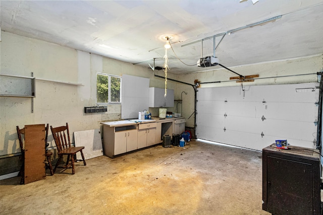 garage featuring a workshop area and a garage door opener