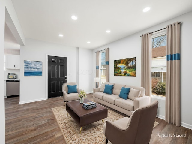 living room featuring recessed lighting, baseboards, and wood finished floors