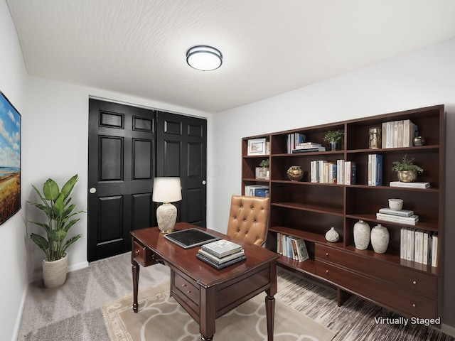 office area with light colored carpet and baseboards