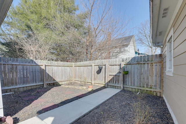 view of yard with a fenced backyard