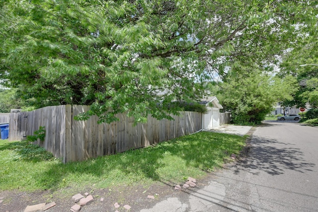 109 W Pacemont Rd, Columbus, OH 43202 - view of yard featuring fence and asphalt driveway