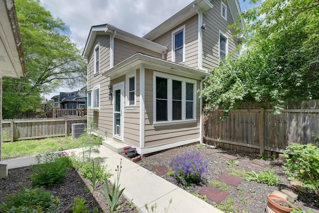 109 W Pacemont Rd, Columbus, OH 43202 - view of property exterior featuring a fenced backyard and central air condition unit