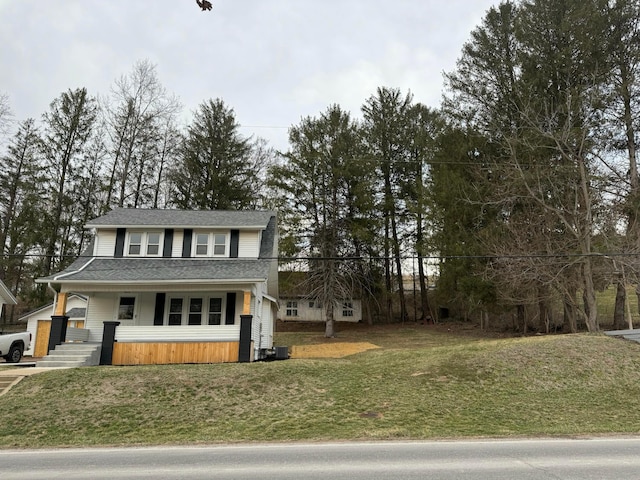 traditional home featuring a front yard and central AC unit