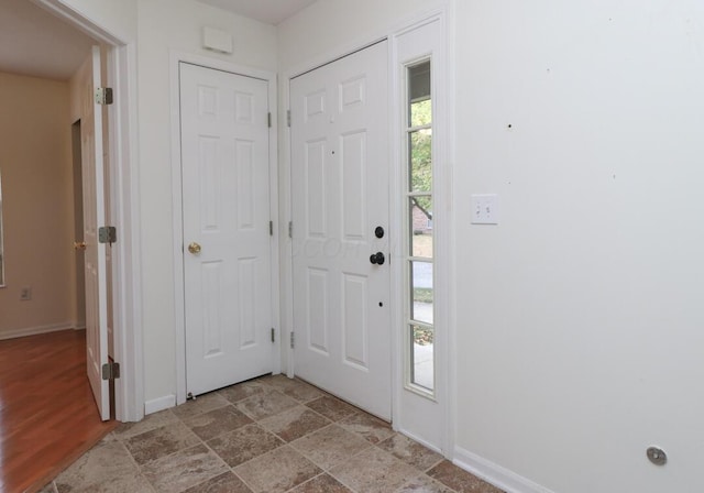 foyer entrance with baseboards