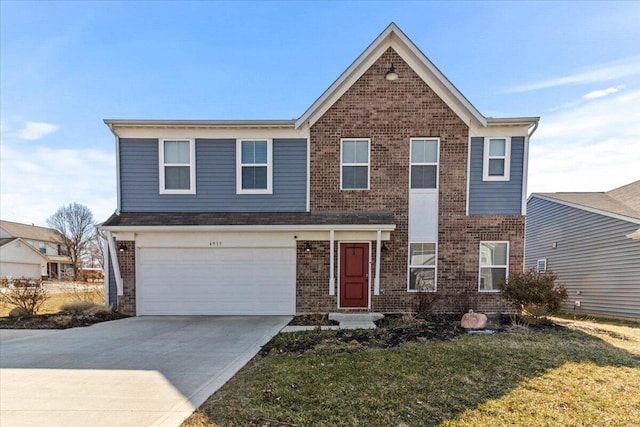 traditional-style house with brick siding, an attached garage, driveway, and a front lawn