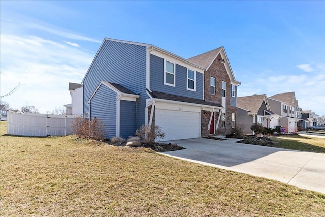 view of front of home with a front lawn, fence, a residential view, a garage, and driveway