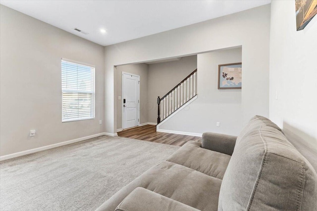 carpeted foyer with stairway, recessed lighting, baseboards, and visible vents