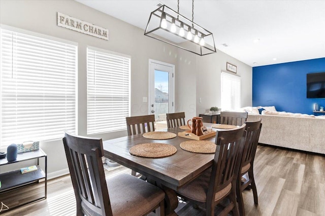 dining space featuring light wood-style flooring