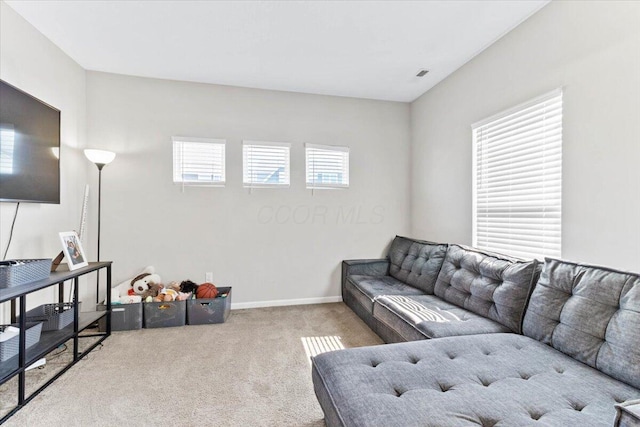 living room with carpet flooring and baseboards