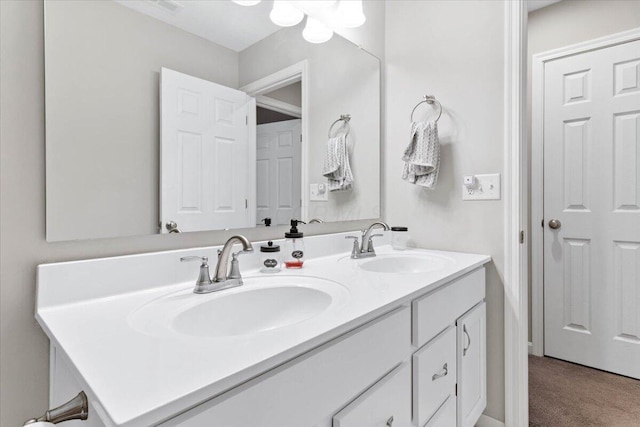 bathroom with double vanity and a sink