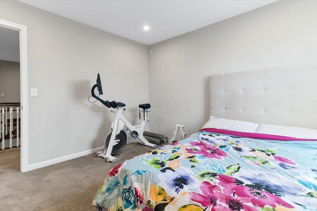 bedroom with carpet flooring and baseboards