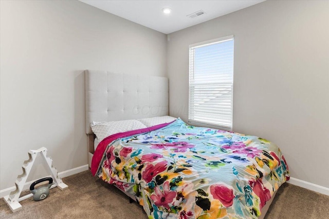 bedroom featuring visible vents, baseboards, and carpet flooring