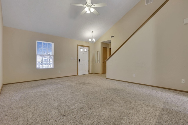 unfurnished living room with ceiling fan with notable chandelier, lofted ceiling, light colored carpet, and baseboards