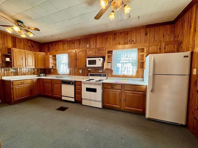 kitchen featuring open shelves, white appliances, wooden walls, and ceiling fan