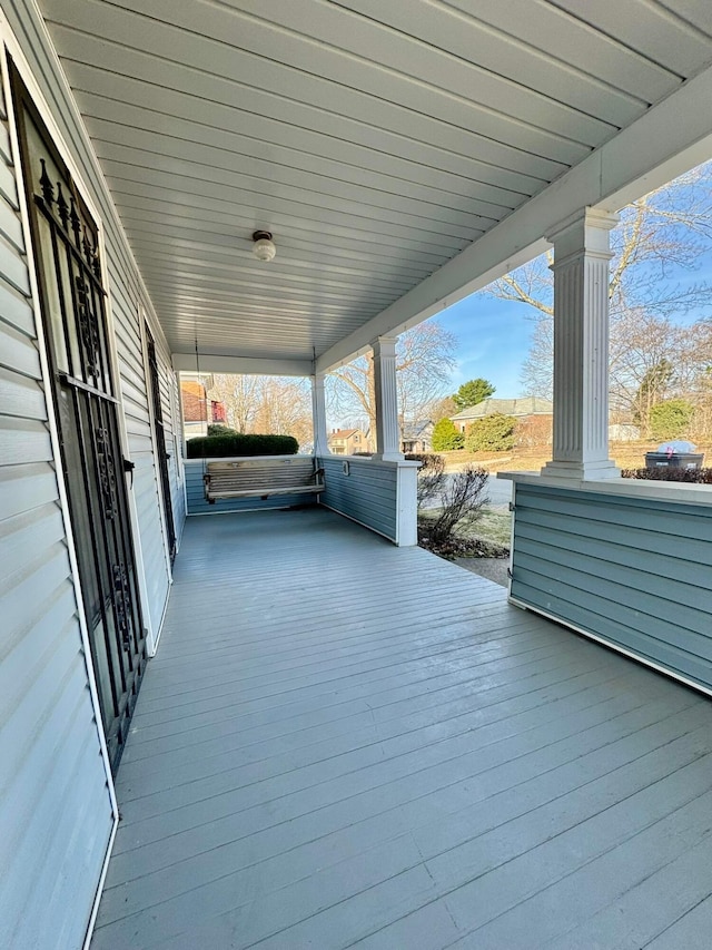 wooden deck featuring covered porch