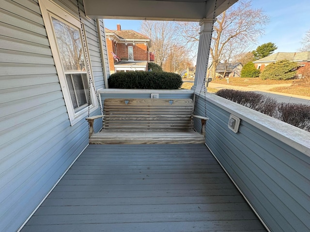 wooden deck featuring covered porch