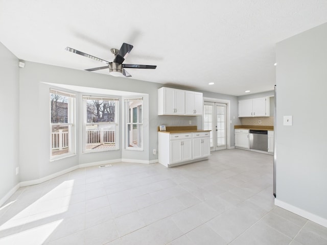 unfurnished living room featuring visible vents, baseboards, light tile patterned floors, recessed lighting, and a ceiling fan