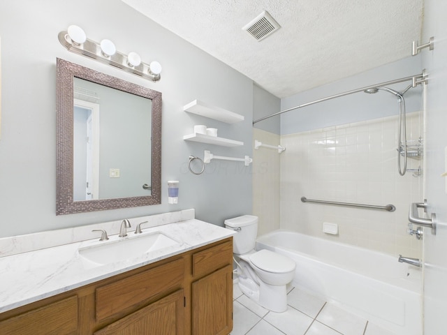 bathroom featuring vanity, visible vents, a textured ceiling, tile patterned floors, and toilet