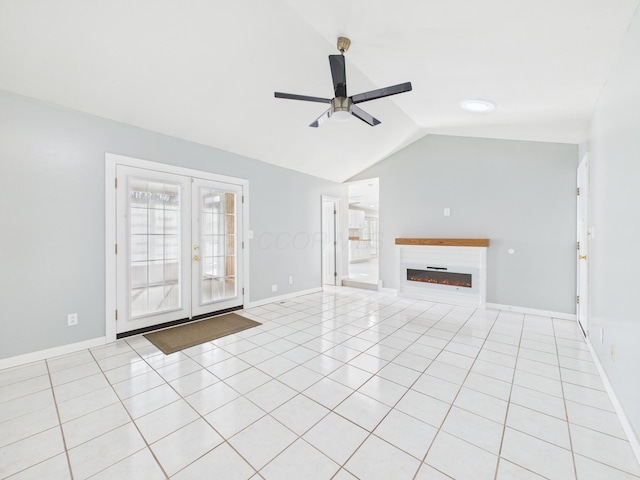 unfurnished living room featuring a ceiling fan, french doors, baseboards, light tile patterned floors, and lofted ceiling