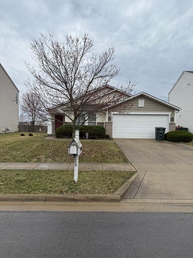 single story home featuring a front yard, an attached garage, driveway, and fence