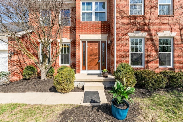 property entrance with brick siding