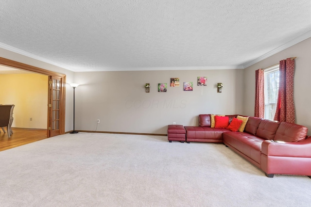 living area featuring light colored carpet, a textured ceiling, crown molding, and baseboards