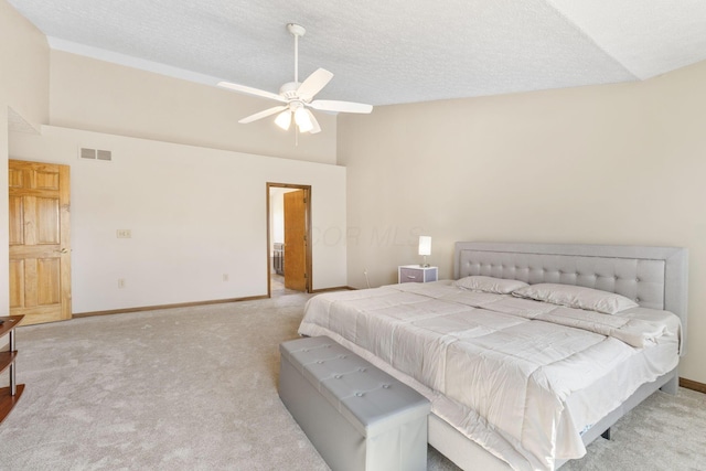 carpeted bedroom featuring baseboards, visible vents, high vaulted ceiling, ceiling fan, and a textured ceiling