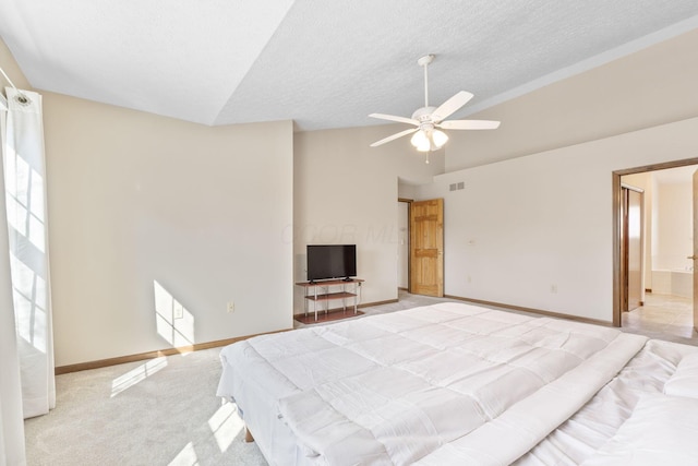 bedroom featuring vaulted ceiling, light colored carpet, baseboards, and a textured ceiling