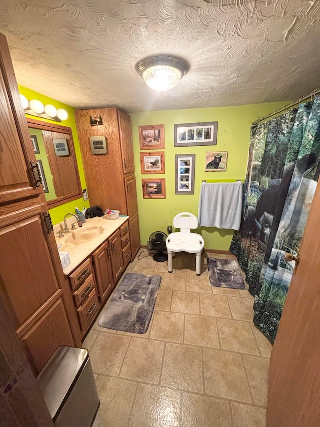 bathroom featuring vanity and a textured ceiling