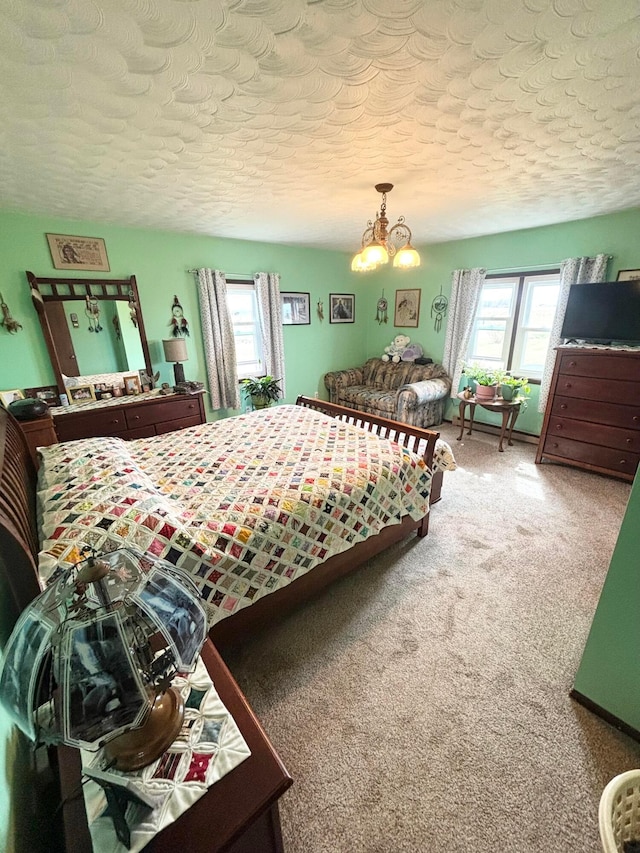 carpeted bedroom featuring an inviting chandelier, multiple windows, and a textured ceiling