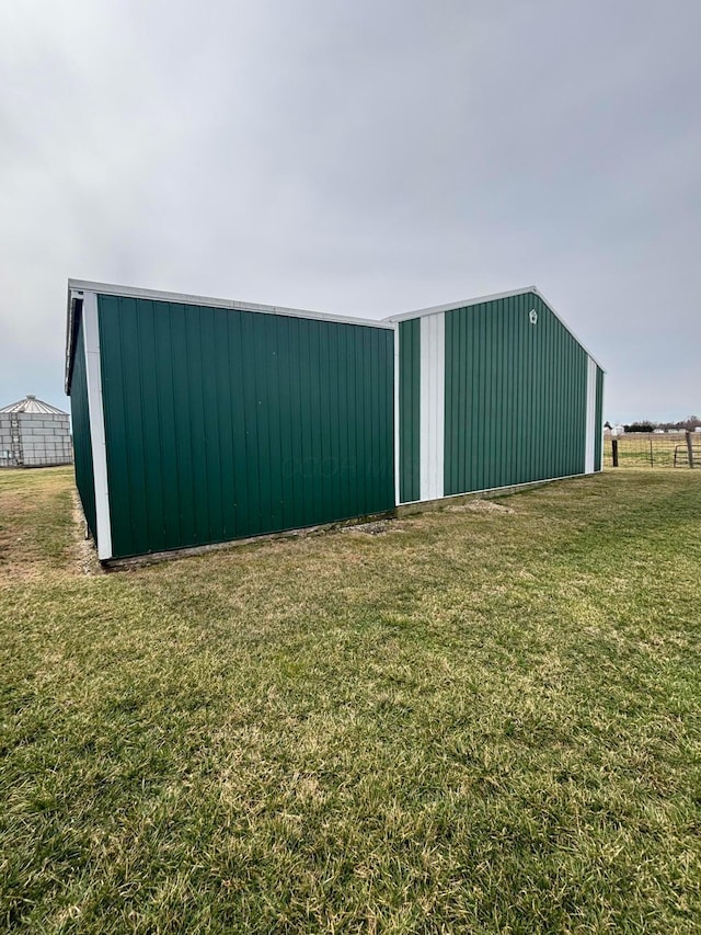 view of pole building with a yard