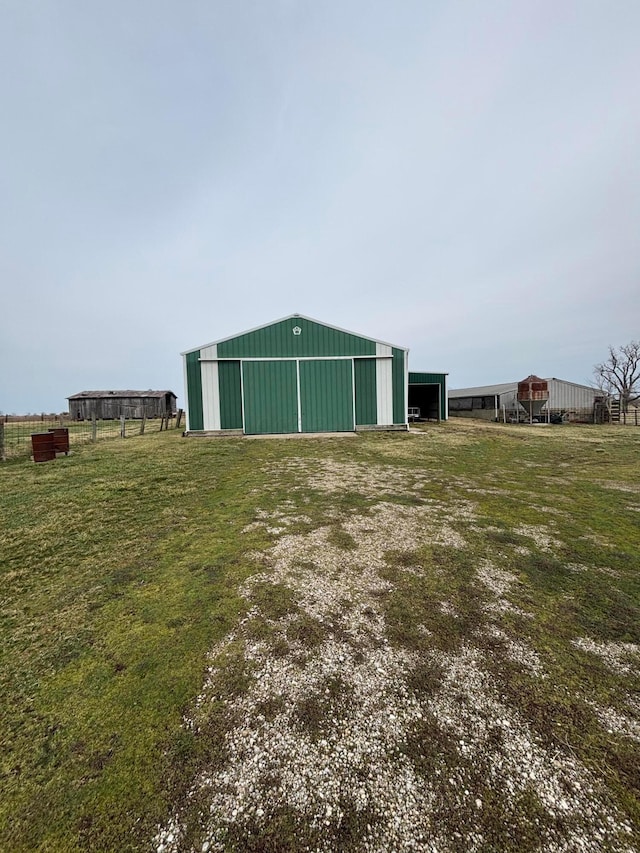 view of pole building with driveway