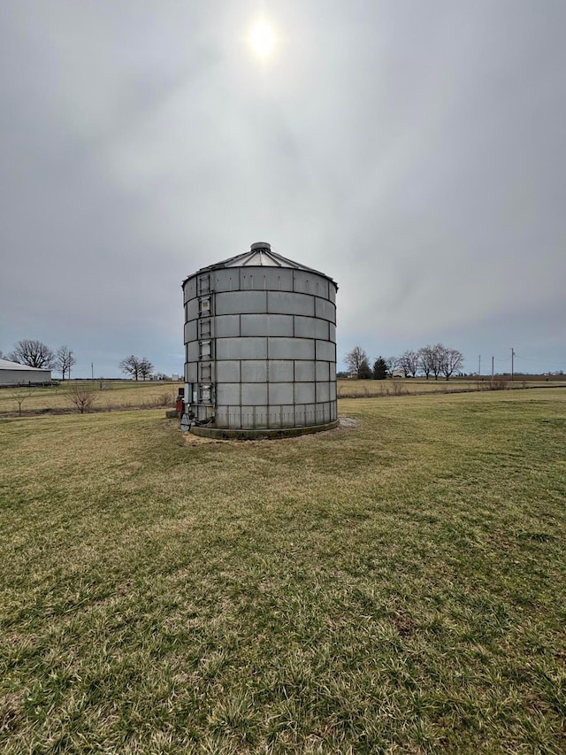 view of outdoor structure with an outbuilding and a rural view