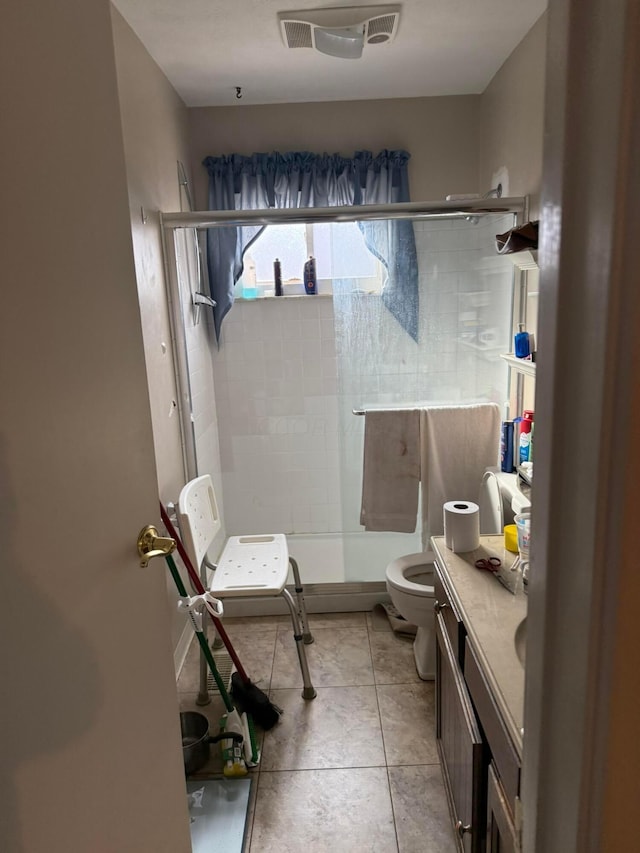 full bathroom featuring tile patterned floors, visible vents, toilet, a shower stall, and vanity