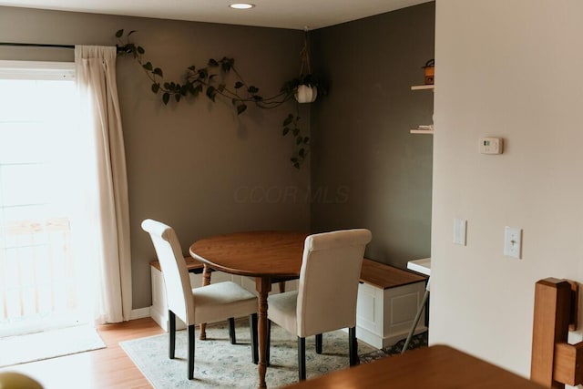 dining area featuring recessed lighting and light wood-style flooring