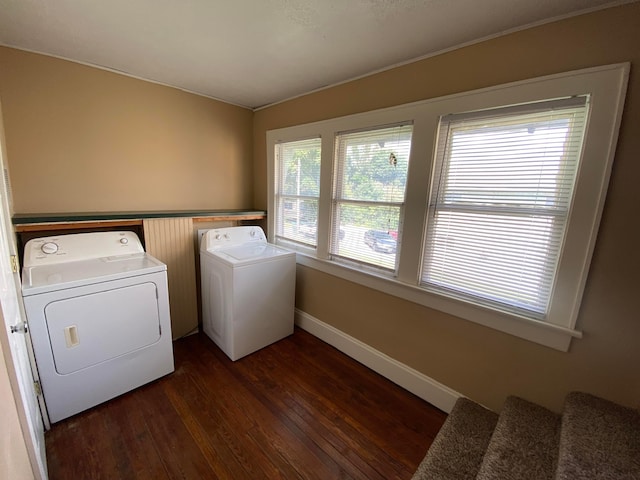 washroom featuring baseboards, independent washer and dryer, dark wood finished floors, and laundry area