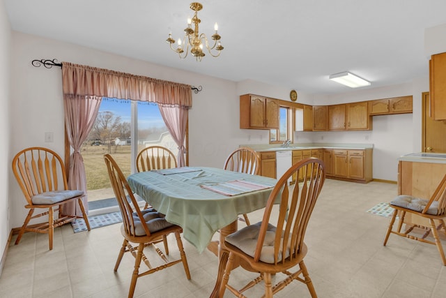 dining area with light floors, baseboards, and a chandelier