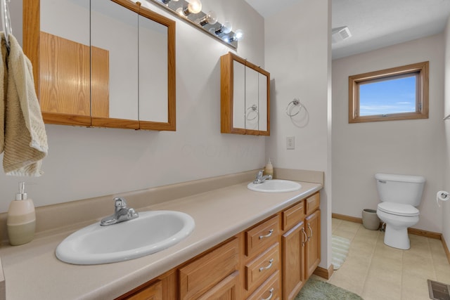 full bath featuring double vanity, visible vents, and a sink