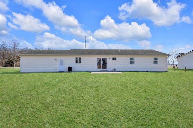 back of house featuring a patio, central air condition unit, and a yard