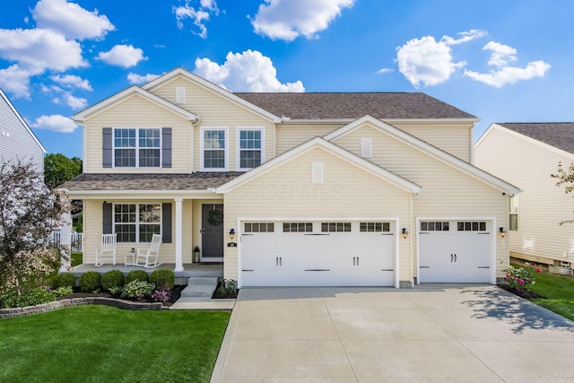 view of front of home with a porch, an attached garage, a shingled roof, concrete driveway, and a front lawn