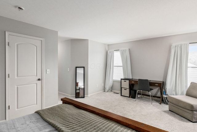 bedroom featuring baseboards and carpet floors