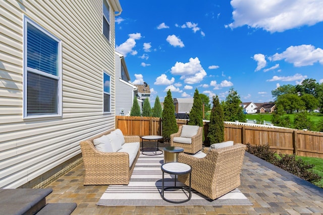 view of patio with an outdoor hangout area and a fenced backyard